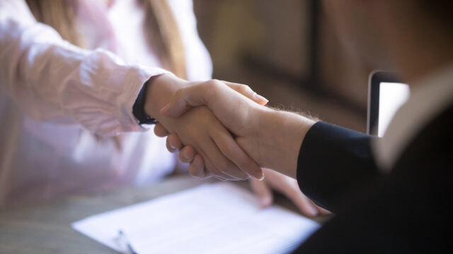 Handshake of man and woman
