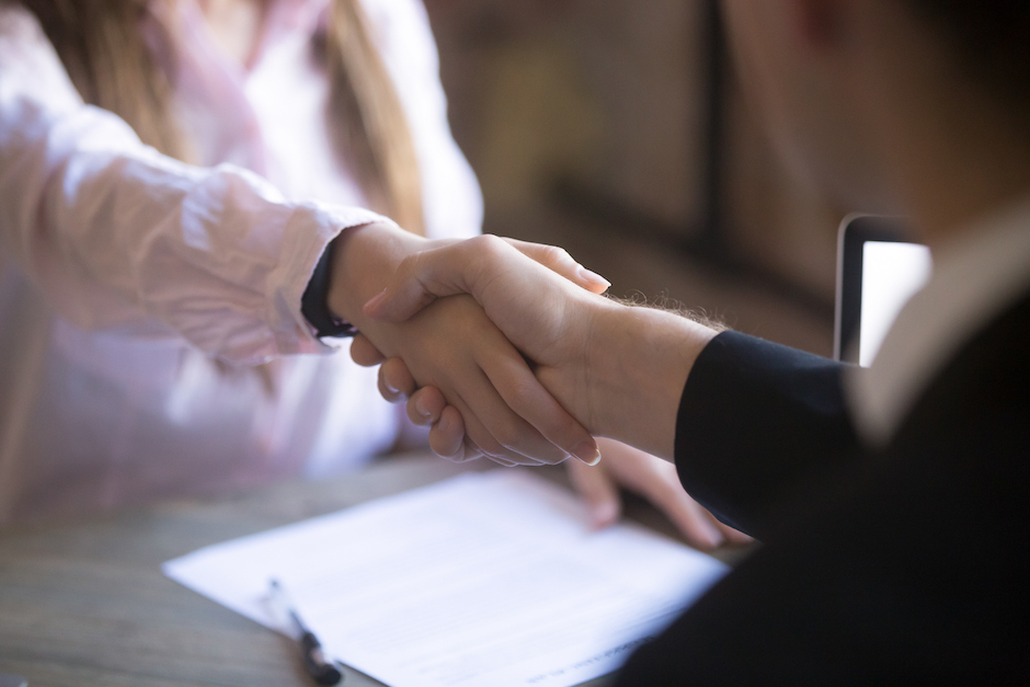 Handshake of man and woman